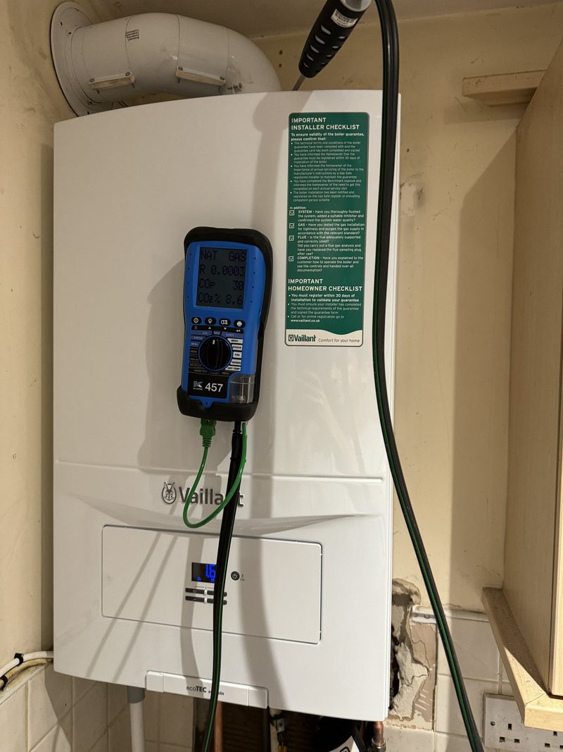 Vaillant boiler being commissioned with a flue gas analyser