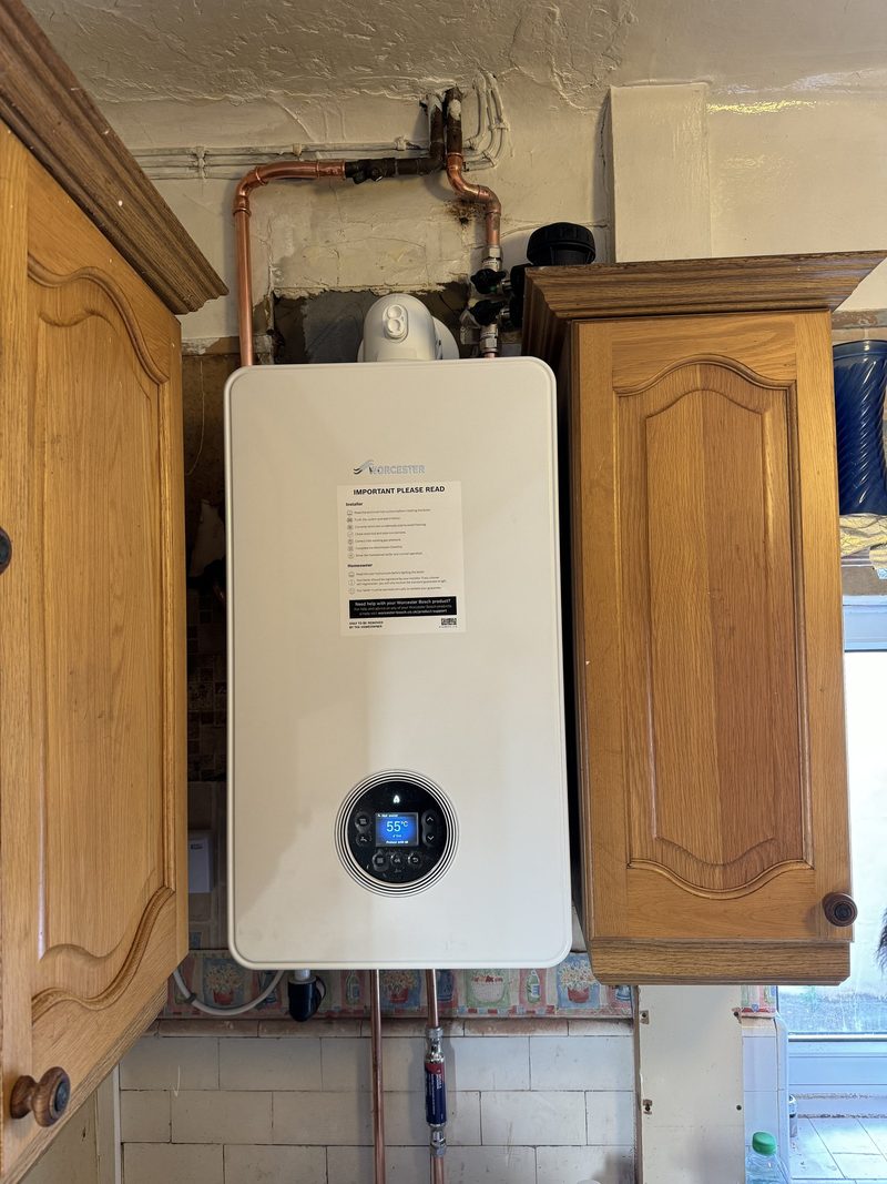 Worcester Bosch boiler neatly fitted between kitchen cupboards
